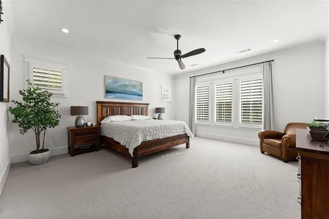 a living room with furniture a rug and a chandelier