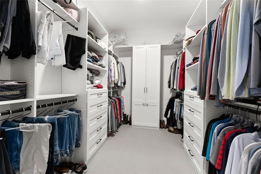 3116 Winding Lake Court Gainesville, GA 30504 - Photo 32 of 94 a view of walk in closet with clothes and shoes