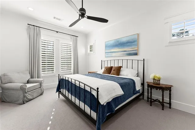 a view of a room with furniture and wooden floor