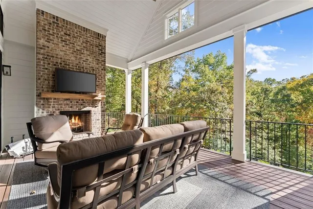 a view of a chairs and table in the balcony