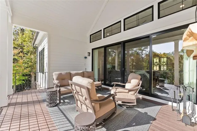 a view of a chairs and table in the patio