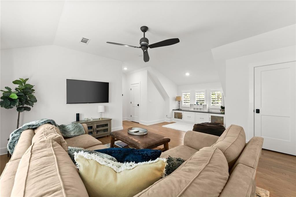 3116 Winding Lake Court Gainesville, GA 30504 - Photo 40 of 94 a living room with furniture and a flat screen tv