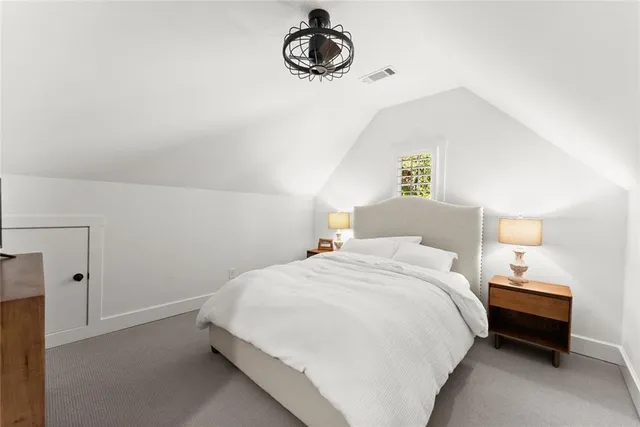 a view of house with yard and staircase