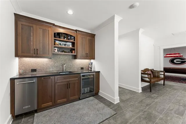a view of a patio with a dining table and chairs with wooden floor