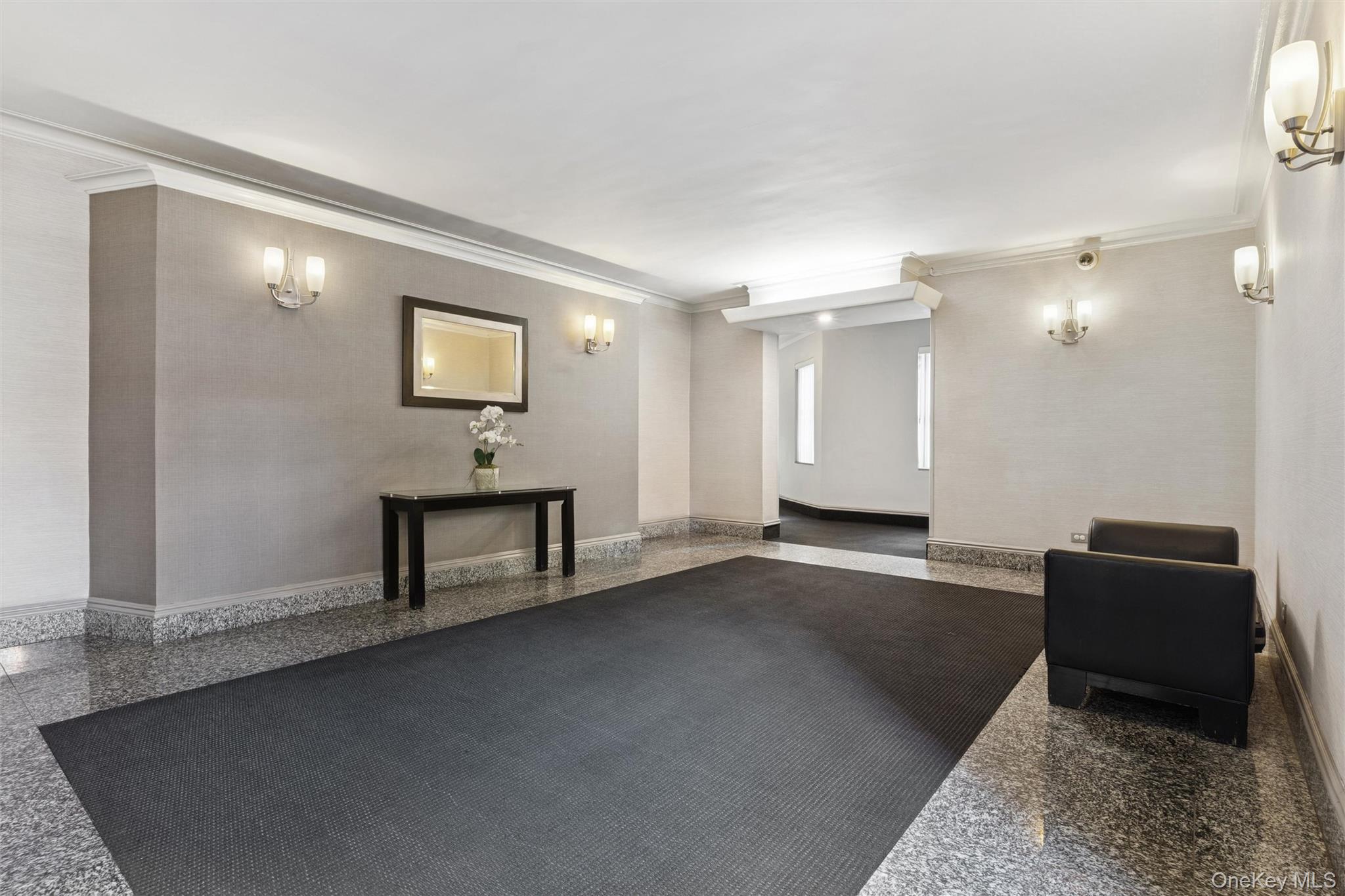 67-12 Yellowstone Boulevard, Unit B16 Queens, NY 11375 - Photo 14 of 15 Common area featuring ornamental molding