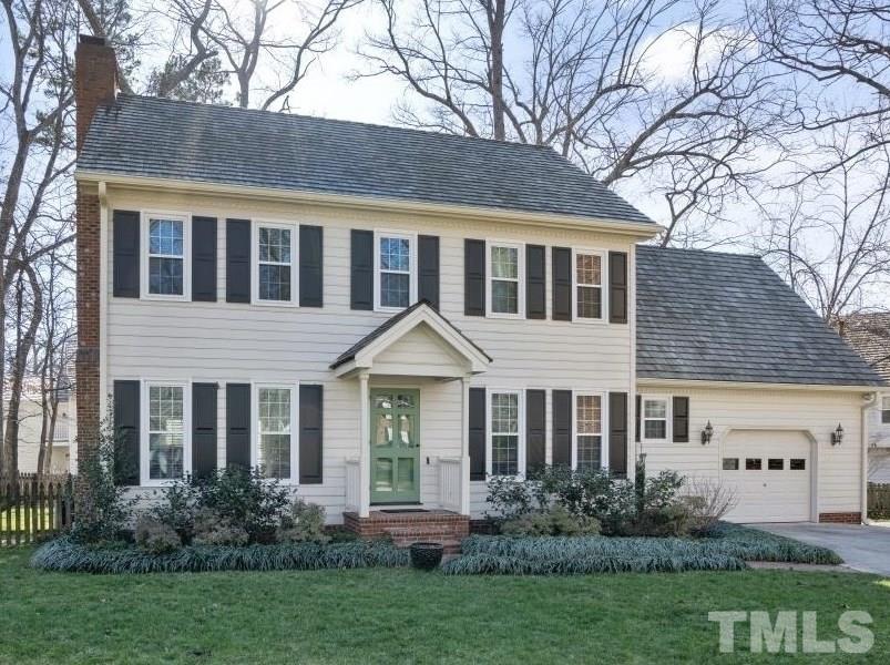2209 Middlefield Court Raleigh, NC 27615 - Photo 1 of 25 a front view of a house with garden
