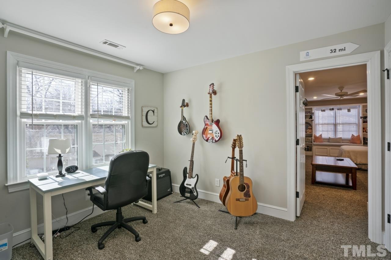2209 Middlefield Court Raleigh, NC 27615 - Photo 19 of 25 a view of a workspace with furniture and a window