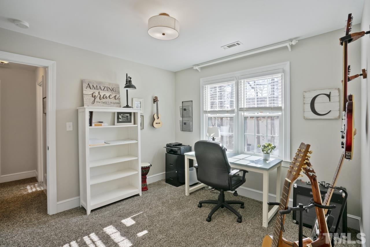 2209 Middlefield Court Raleigh, NC 27615 - Photo 20 of 25 a view of a workspace with furniture and a window