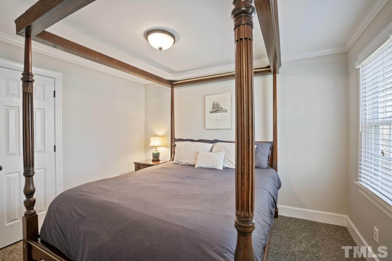 2209 Middlefield Court Raleigh, NC 27615 - Photo 21 of 25 a bedroom with a bed and a window