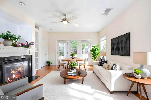 a view of a house with swimming pool and sitting area