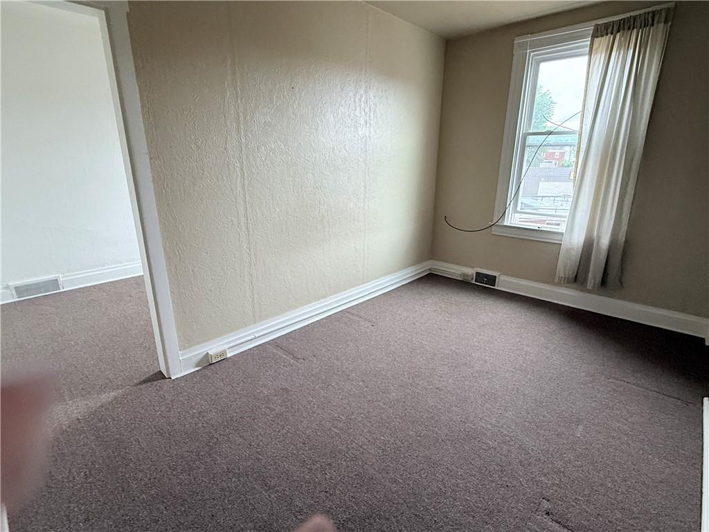 112 Greydon Avenue McKees Rocks, PA 15136 - Photo 11 of 14 an empty room with windows