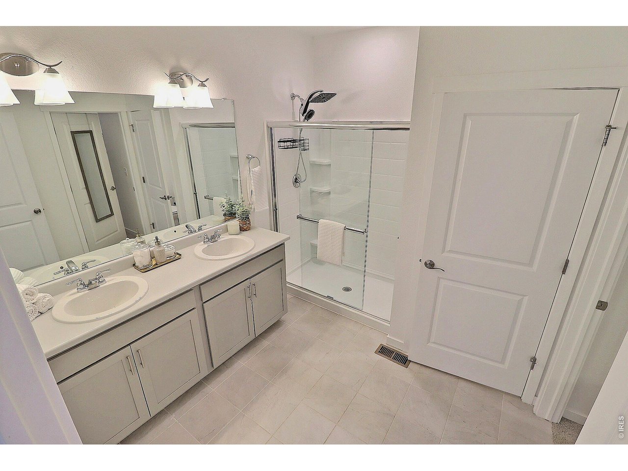 1269 Wild Basin Road Severance, CO 80550 - Photo 27 of 45 Primary bath with double sinks and large walk-in closet