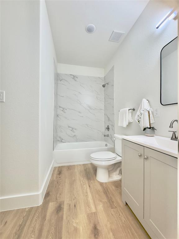 3801 Carpenter Avenue Dallas, TX 75210 - Photo 15 of 19 a bathroom with a sink a toilet and shower