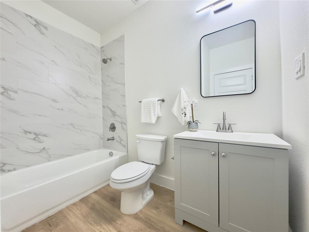3801 Carpenter Avenue Dallas, TX 75210 - Photo 16 of 19 a bathroom with a sink toilet and shower