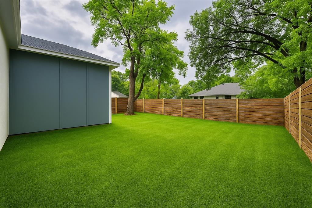 3801 Carpenter Avenue Dallas, TX 75210 - Photo 3 of 19 a view of a backyard with a wooden fence