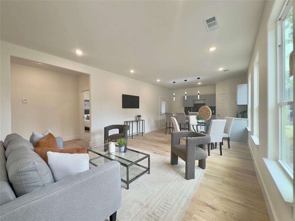 3801 Carpenter Avenue Dallas, TX 75210 - Photo 4 of 19 a living room with furniture and a large window