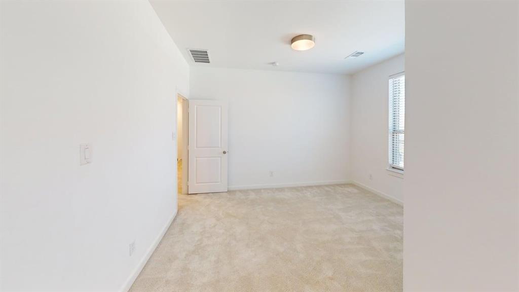 9628 Boulder Pt Road Oak Point, TX 75068 - Photo 16 of 35 Carpeted room featuring white walls, a single window with blinds, a white door, and a flush-mount ceiling light fixture