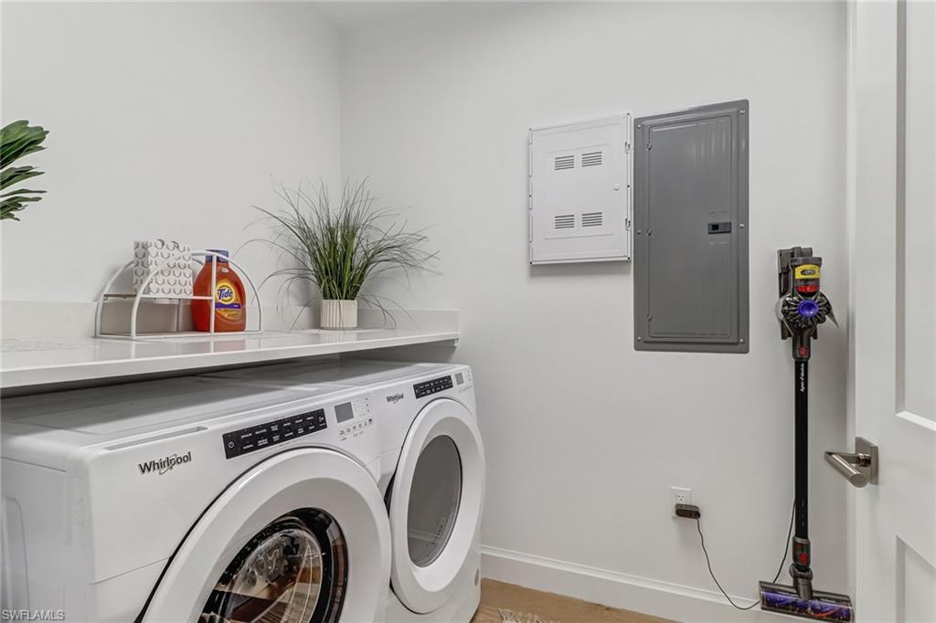 1115 Central Avenue, Unit 340 Naples, FL 34102 - Photo 13 of 39 a view of livingroom with washer and dryer