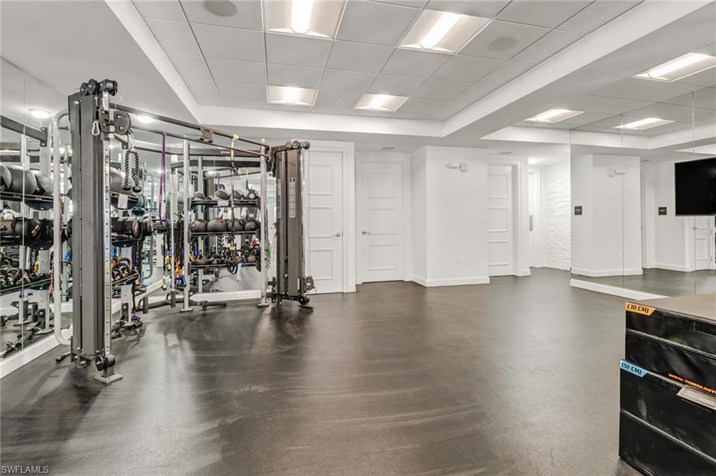 1115 Central Avenue, Unit 340 Naples, FL 34102 - Photo 30 of 39 a view of empty room with wooden floor