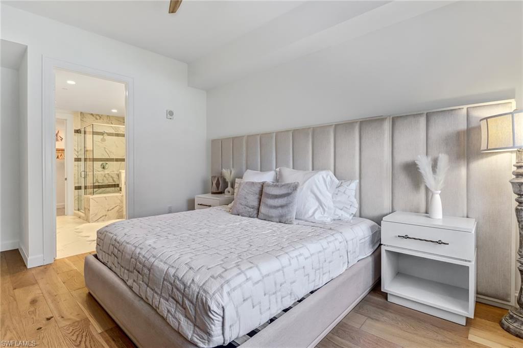 1115 Central Avenue, Unit 340 Naples, FL 34102 - Photo 5 of 39 a bedroom with a bed and a window