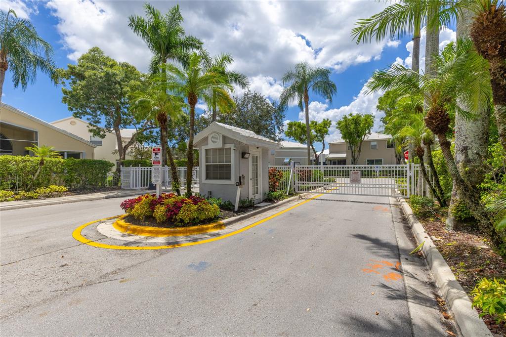 9424 Northwest 8th Circle Plantation, FL 33324 - Photo 11 of 57 a house with palm tree in front of it