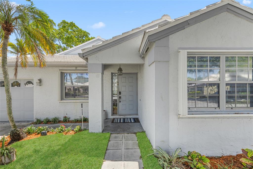 9424 Northwest 8th Circle Plantation, FL 33324 - Photo 15 of 57 a front view of a house with garden