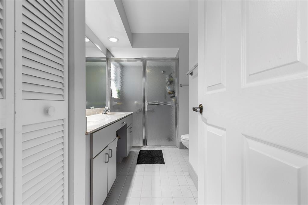 9424 Northwest 8th Circle Plantation, FL 33324 - Photo 19 of 57 a bathroom with a sink a toilet and shower