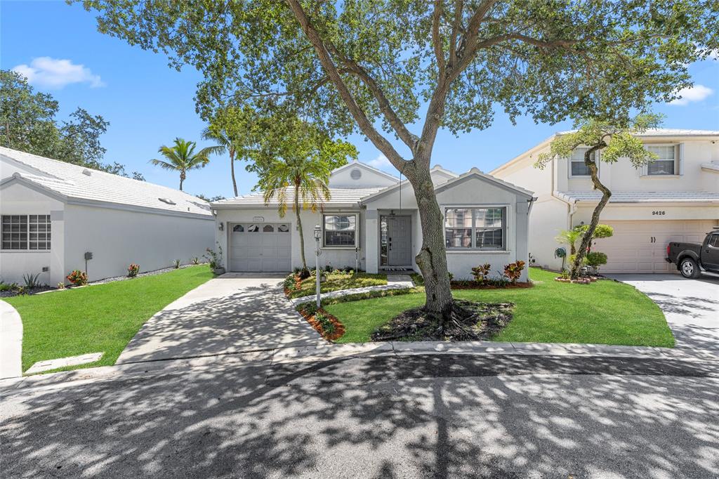 9424 Northwest 8th Circle Plantation, FL 33324 - Photo 21 of 57 a front view of a house with garden