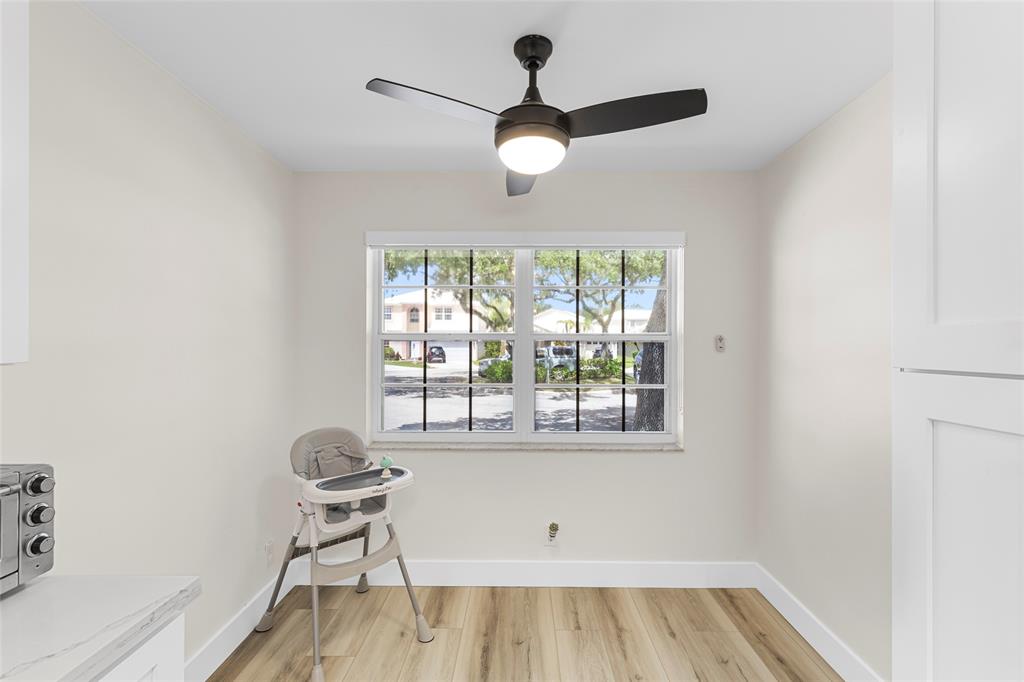 9424 Northwest 8th Circle Plantation, FL 33324 - Photo 22 of 57 a view of a room with wooden floor and windows