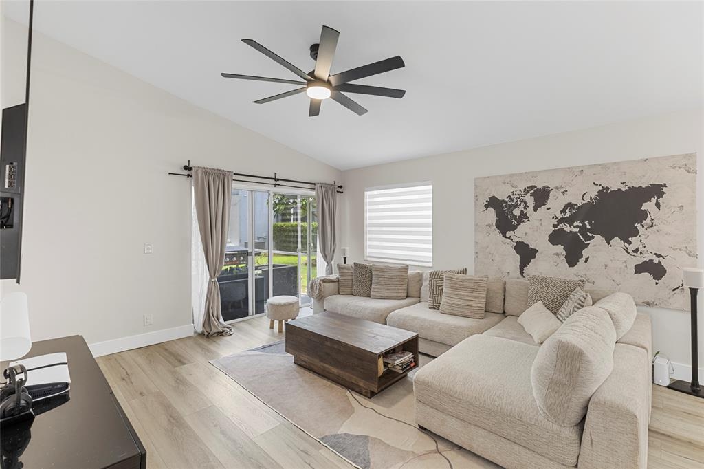 9424 Northwest 8th Circle Plantation, FL 33324 - Photo 26 of 57 a living room with furniture and a large window