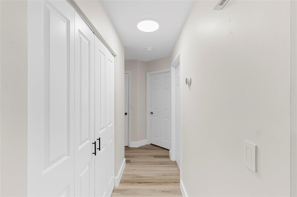 9424 Northwest 8th Circle Plantation, FL 33324 - Photo 29 of 57 a view of a hallway with wooden floor and staircase