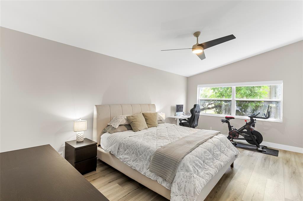 9424 Northwest 8th Circle Plantation, FL 33324 - Photo 33 of 57 a bedroom with a bed and a large window