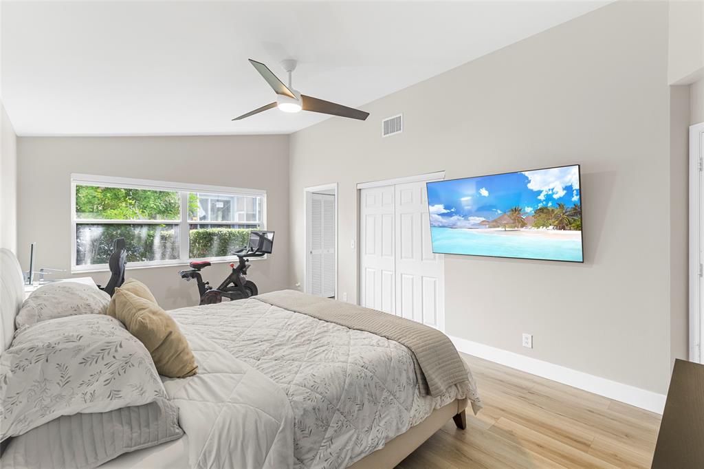 9424 Northwest 8th Circle Plantation, FL 33324 - Photo 34 of 57 a bedroom with bed and a large window