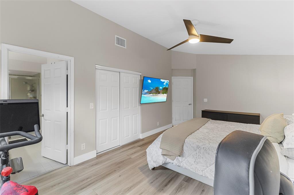 9424 Northwest 8th Circle Plantation, FL 33324 - Photo 35 of 57 a bedroom with a bed and a tv