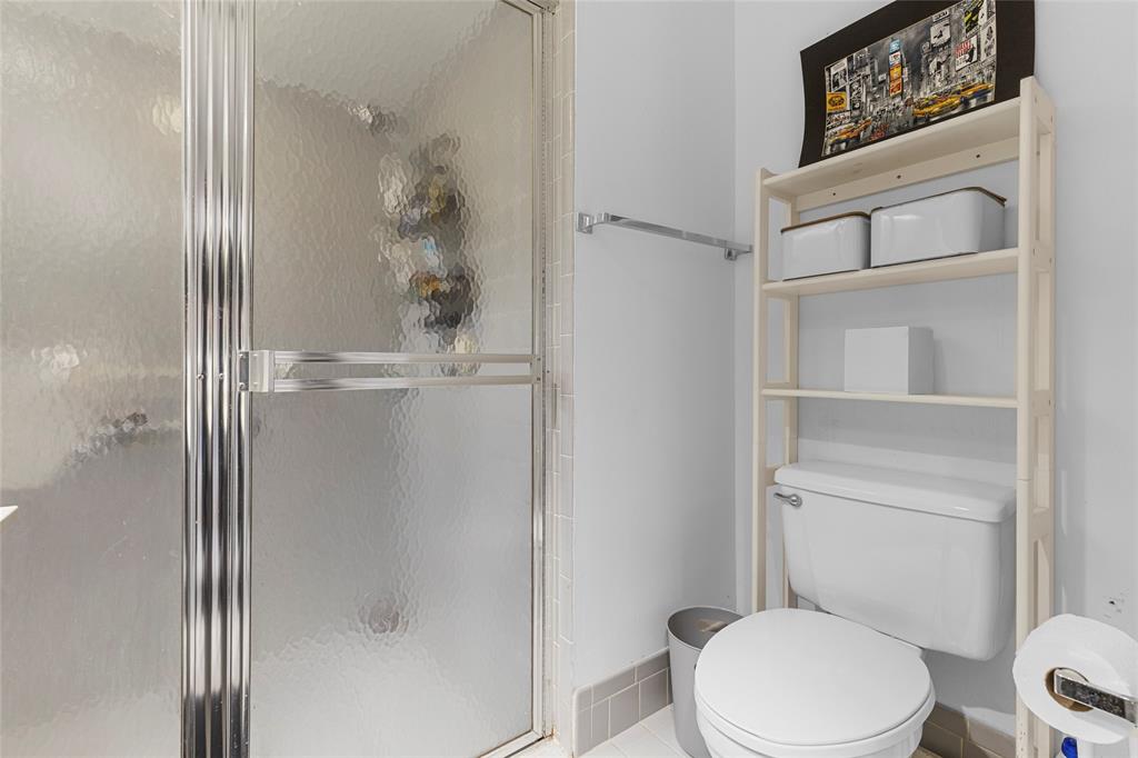 9424 Northwest 8th Circle Plantation, FL 33324 - Photo 37 of 57 a white toilet sitting next to a bathroom sink