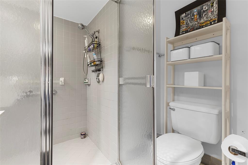 9424 Northwest 8th Circle Plantation, FL 33324 - Photo 38 of 57 a white toilet sitting next to a bathroom sink