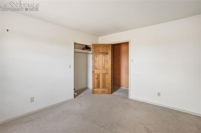 4775 Meridian Road Peyton, CO 80831 - Photo 14 of 25 Bedroom with baseboards and a closet