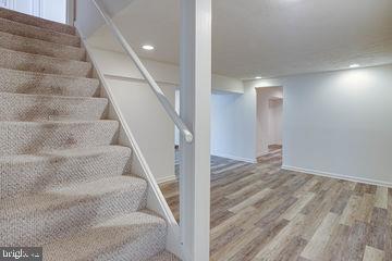12902 Sturbridge Road Woodbridge, VA 22192 - Photo 25 of 40 L/L Stairs leading to large Entertainment Area