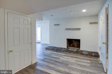 12902 Sturbridge Road Woodbridge, VA 22192 - Photo 30 of 40 Wood Fireplace with Slate and Brick Finishing