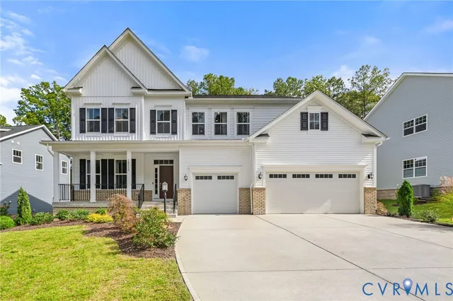 a front view of a house with a yard table and chairs