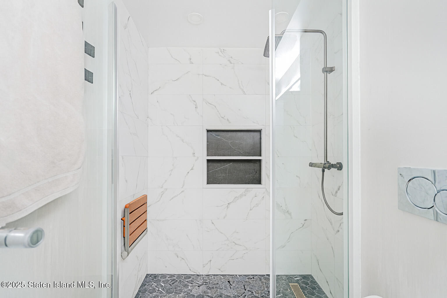 40 Wellington Court, Unit 2A Staten Island, NY 10314 - Photo 16 of 20 a bathroom with a shower and a sink