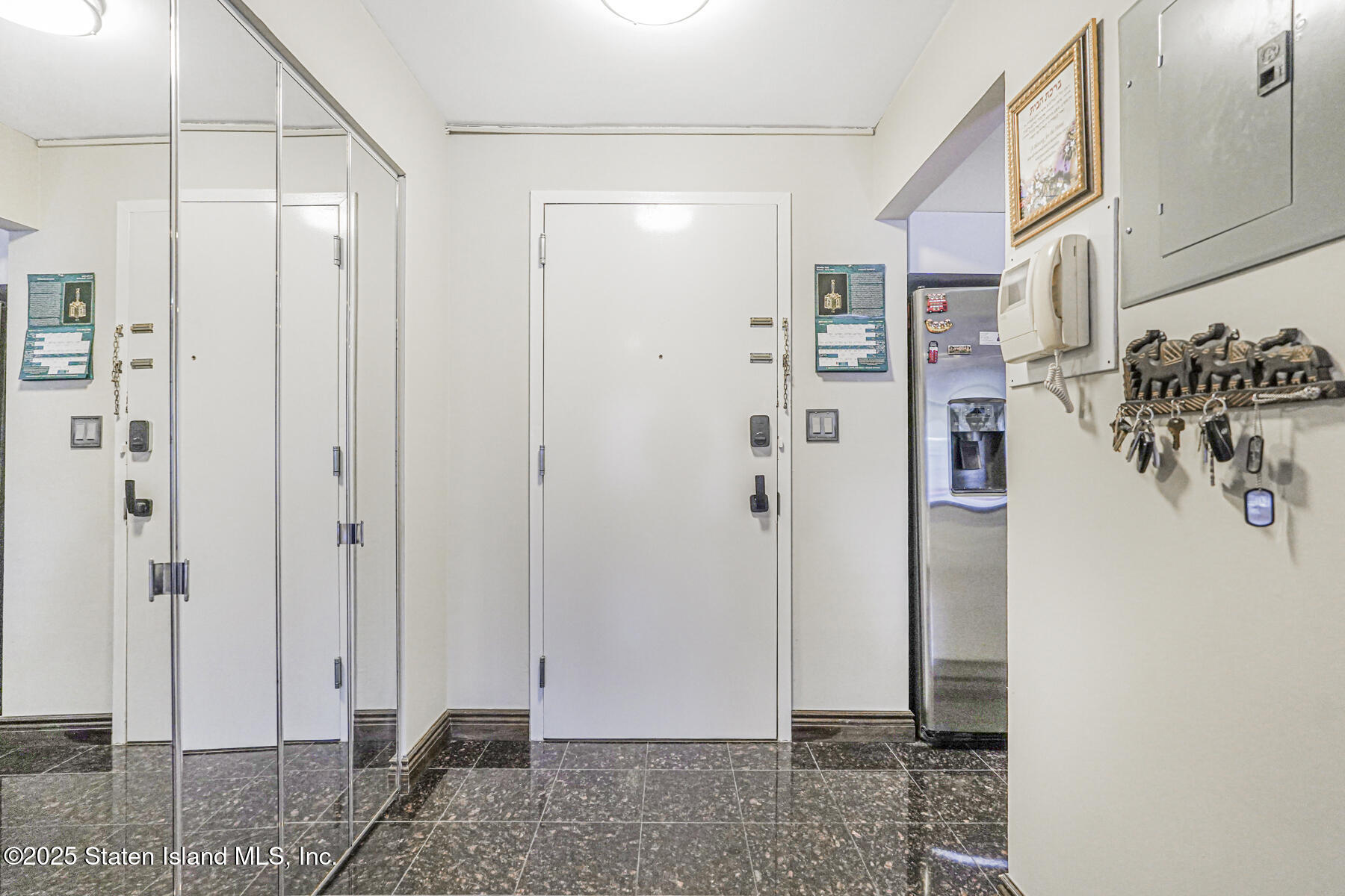 40 Wellington Court, Unit 2A Staten Island, NY 10314 - Photo 2 of 20 a view of a bathroom with a shower and a sink