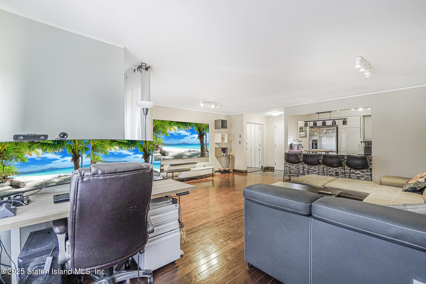 40 Wellington Court, Unit 2A Staten Island, NY 10314 - Photo 10 of 20 a living room with furniture and a flat screen tv