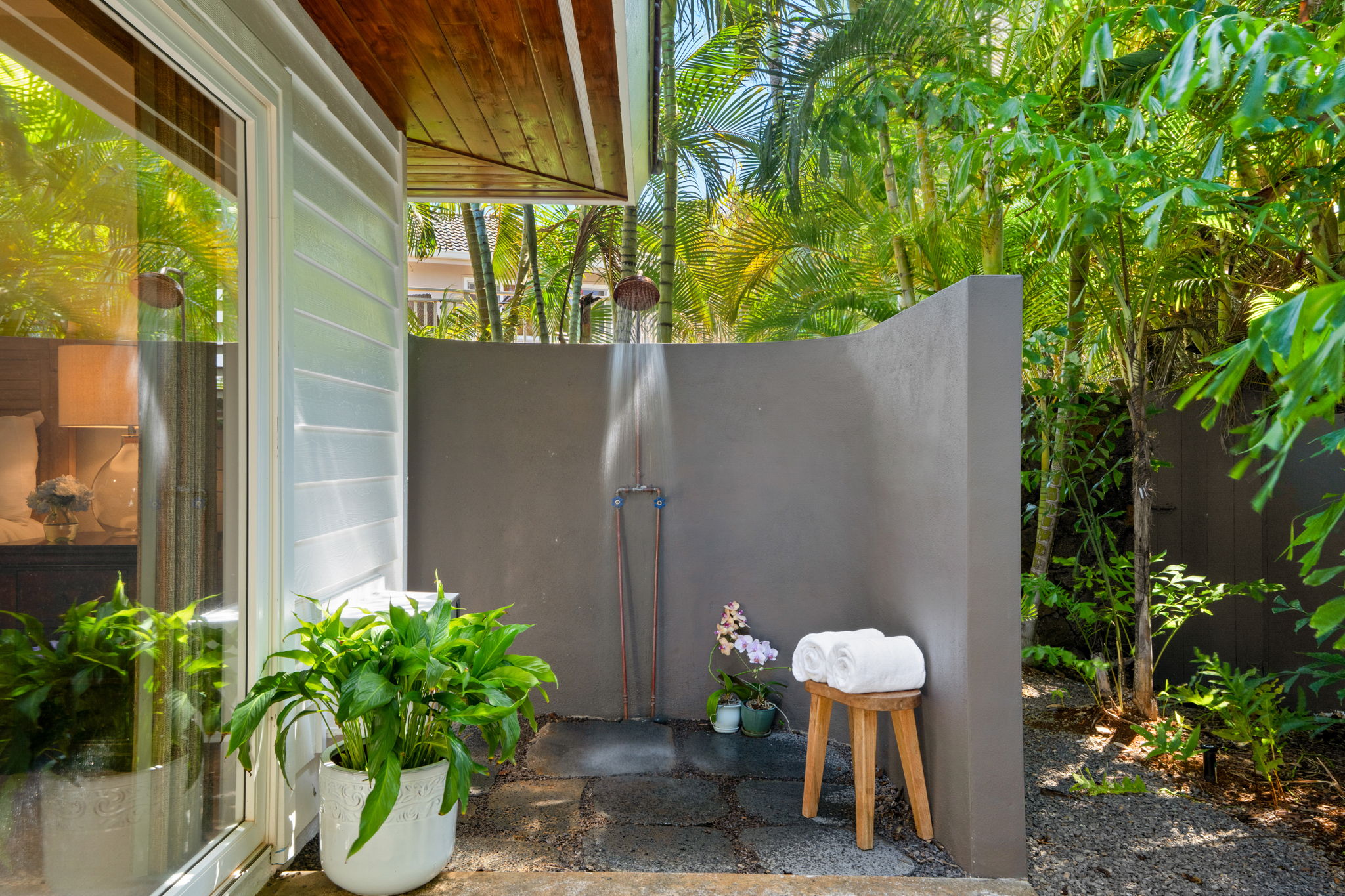 1753 Kelaukia Street Koloa, HI 96756 - Photo 17 of 27 a view of a chairs and table in backyard