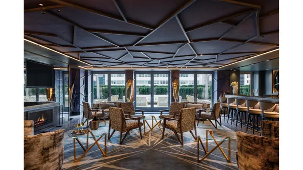 a view of a dining room with furniture wooden floor and chandelier