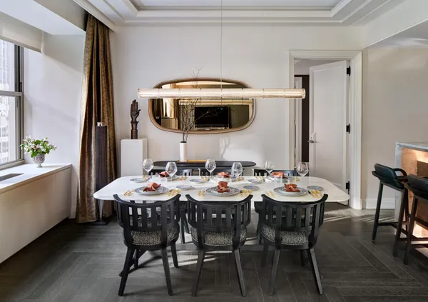 a view of a dining room that has a table and chairs