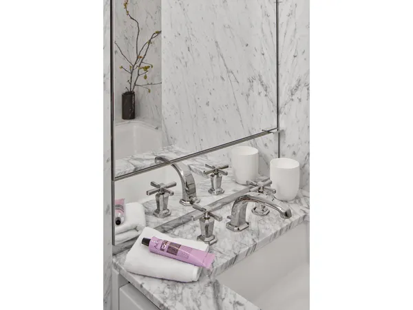 a picture of a bathroom with a sink and a mirror