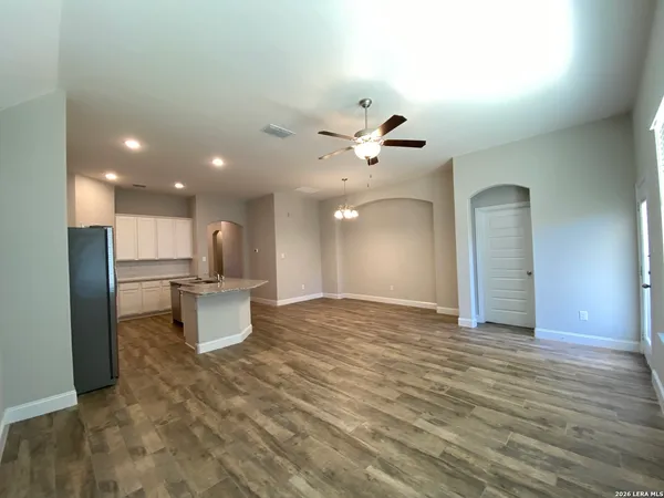a view of a kitchen with a sink and a living room