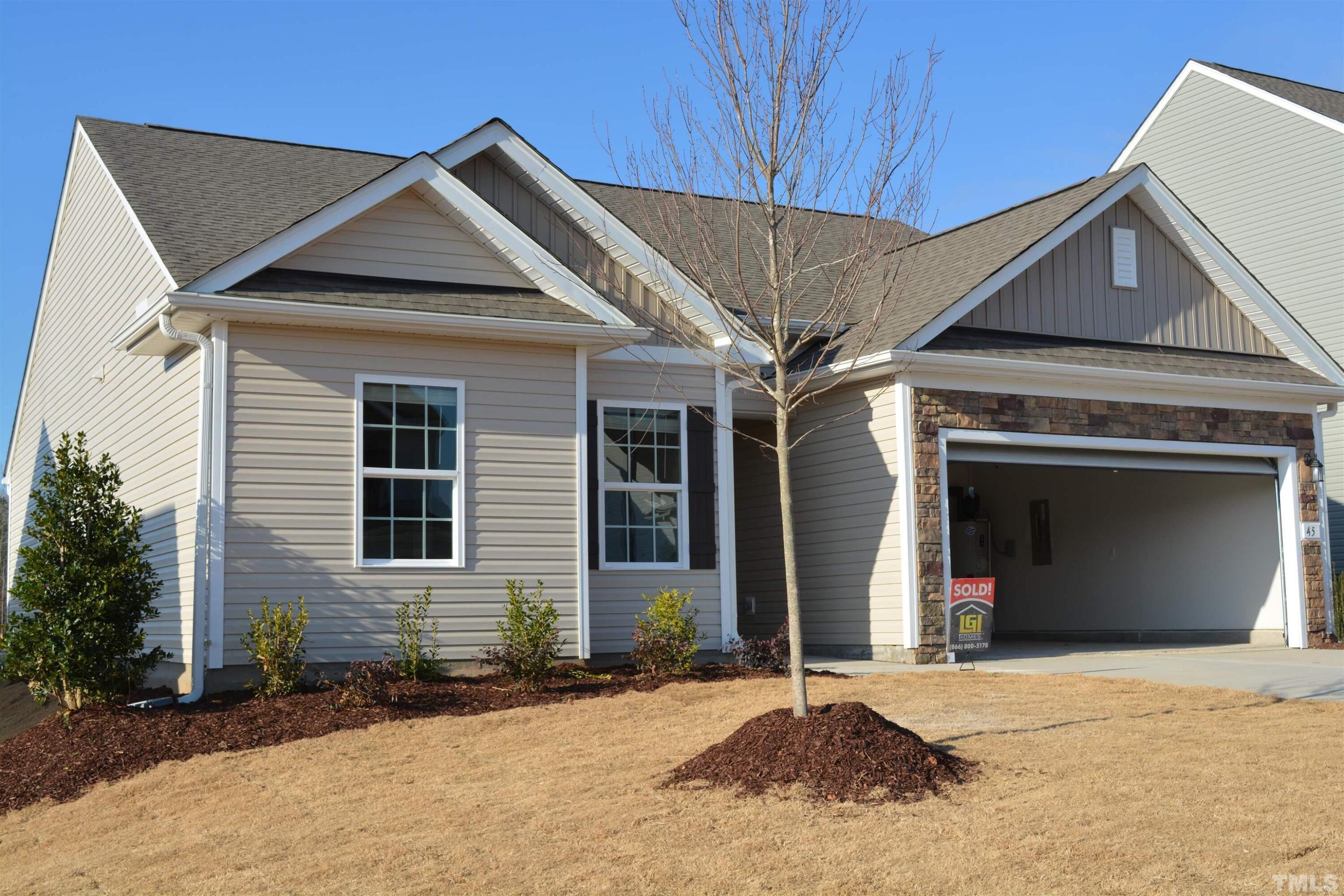 45 Level Drive Youngsville, NC 27596 - Photo 1 of 7 a front view of a house with a yard