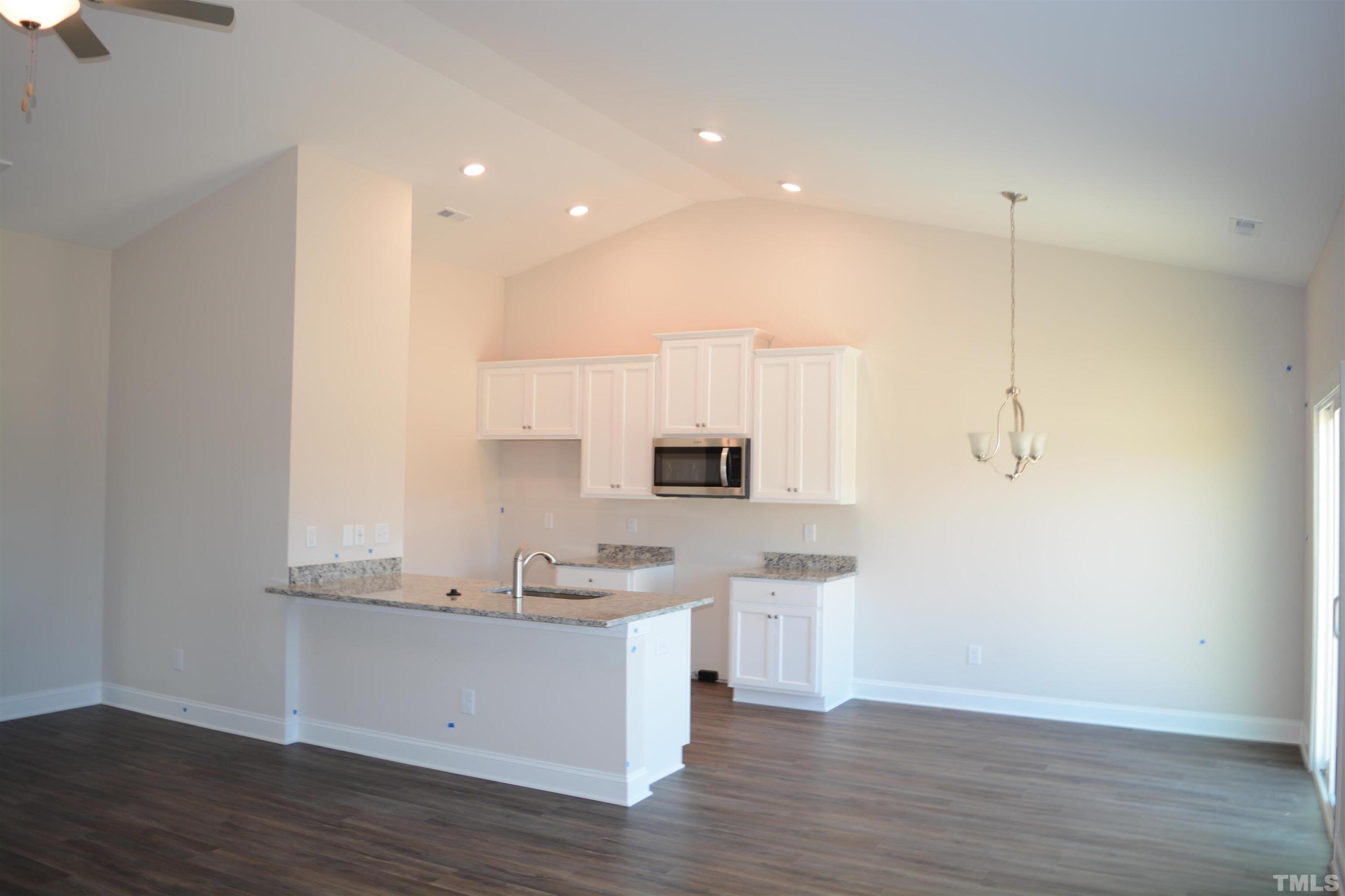 45 Level Drive Youngsville, NC 27596 - Photo 2 of 7 a kitchen with a sink and cabinets
